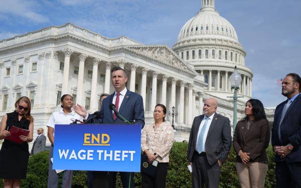 Magaziner speaks outside of the US Capitol