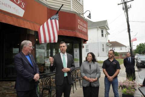 Representative Magaziner speaks in front of restaurant