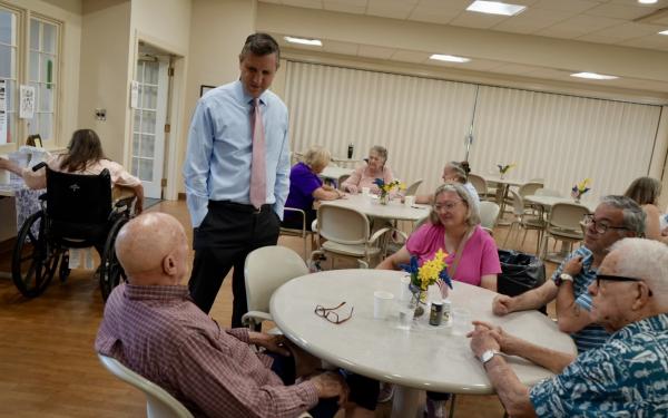 Magaziner speaks with constituents at a senior center