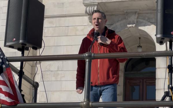 Rep. Magaziner speaks in front of a crowd at the Rhode Island State House