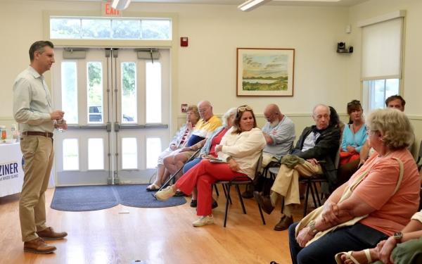 Magaziner speaks at a town hall