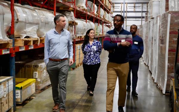 Magaziner walking in a warehouse