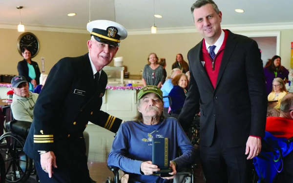 Magaziner and two other men stand together