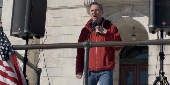 Rep. Magaziner speaks in front of a crowd at the Rhode Island State House
