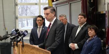 Rep. Magaziner speaks at a podium 