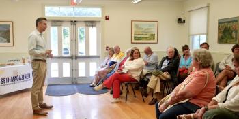 Magaziner speaks at a town hall